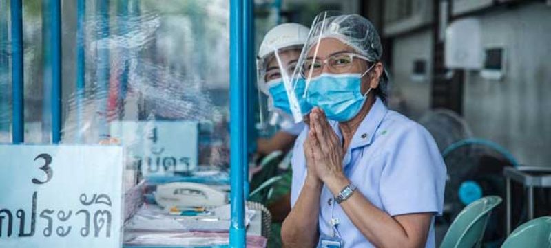 Nurses greet visitors at a clinic set up at a hospital in Thailand to treat people with suspected COVID-19 symptoms-91c3fc3a53ced76d65d13457bdb46ddb1623215536.jpg